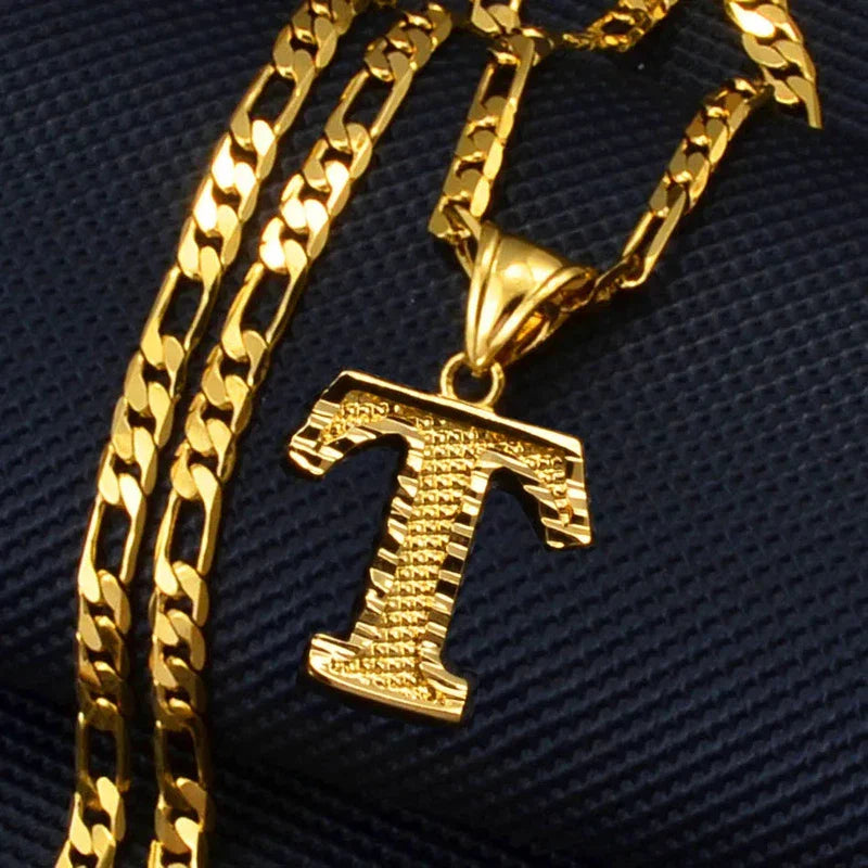 Gold plated pendant necklace with English initial alphabet 'T' on a figaro chain.