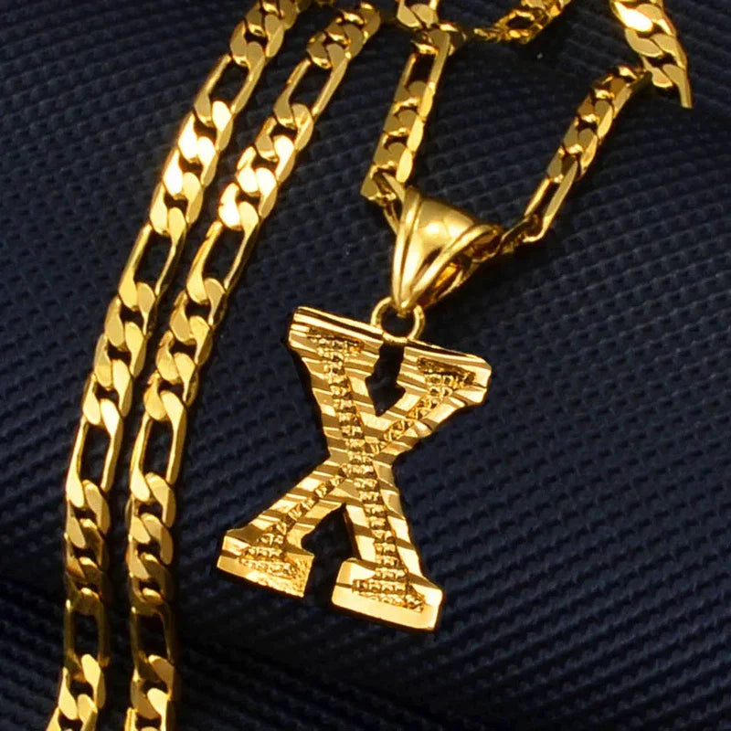 Gold plated initial X pendant necklace on Figaro chain for men, women, and girls.