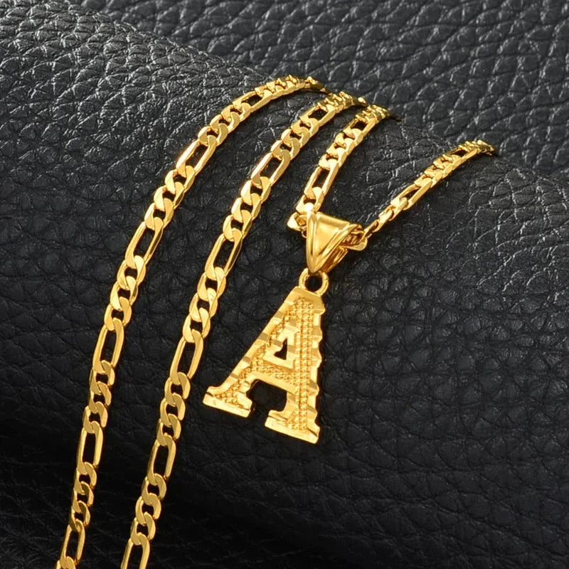 Gold plated letter pendant necklace on a Figaro chain for women, men, and girls.