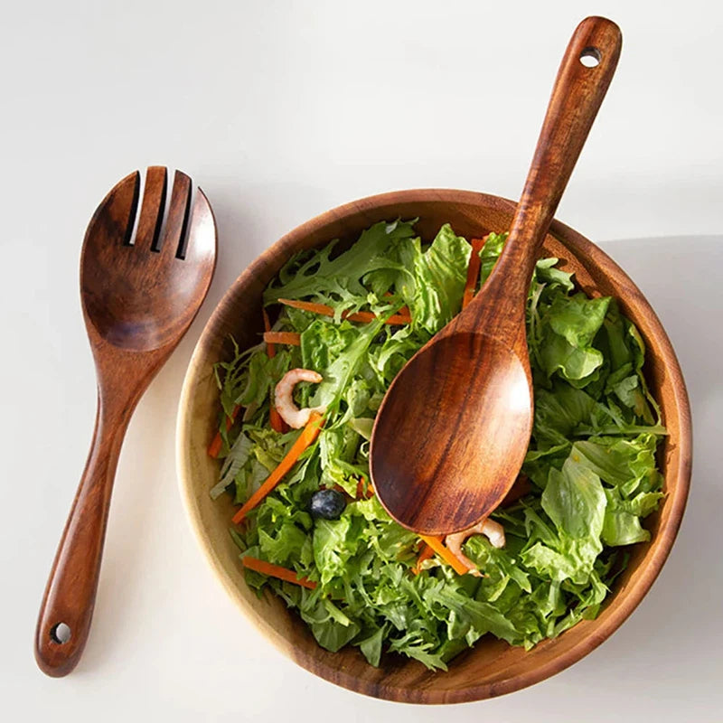 Japanese-style wooden spoon and fork set with long handles, perfect for serving salad.