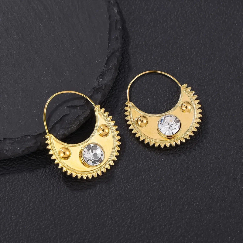 Gold color Ethiopian zircon clip earrings with round drop design for women.