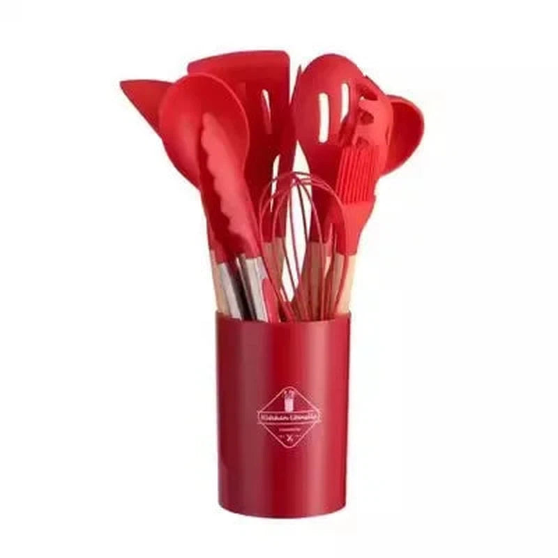 12-piece non-stick silicone kitchen utensil set with wooden handles in red container.