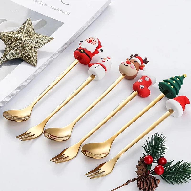 Christmas-themed stainless steel coffee spoons and forks set in festive red and green gift box with Santa, snowman, and reindeer designs.