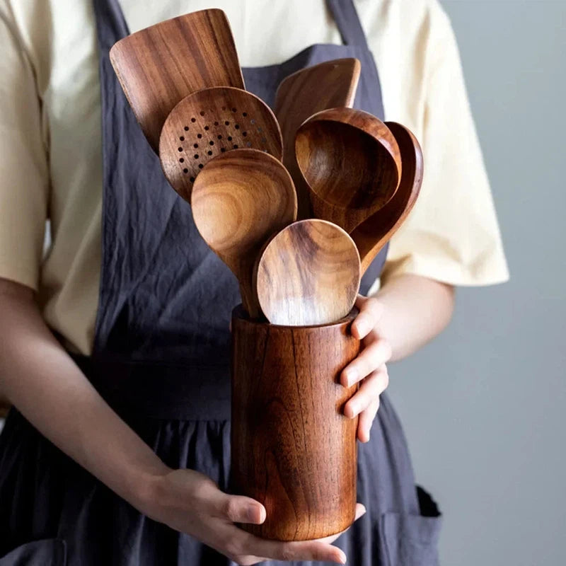 Wooden kitchen utensils set with non-stick cookware and eco-friendly design, featuring 8 pieces including a soup spoon, spatula, and rice spoon.