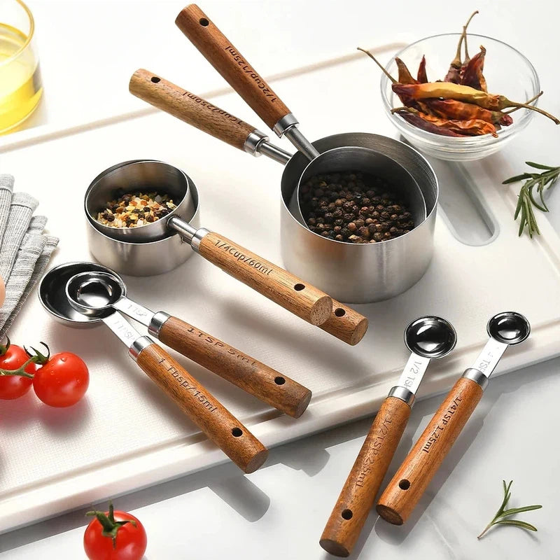 8-piece stainless steel measuring spoons with wooden handles for baking and bartending.