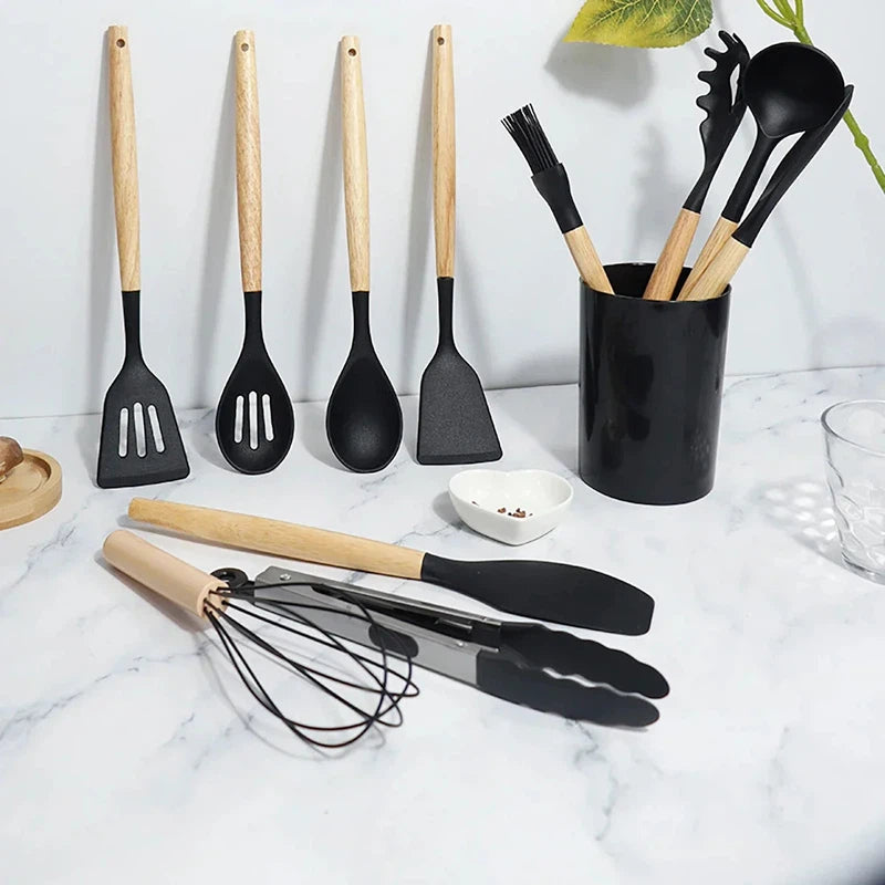 12-piece non-stick silicone kitchen utensils set with wooden handles, featuring spatulas, shovels, and egg beaters.