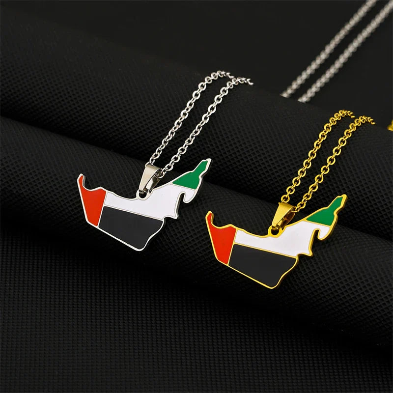 Gold and silver plated UAE map flag pendant necklaces on black surface, featuring stainless steel chains for men and women.